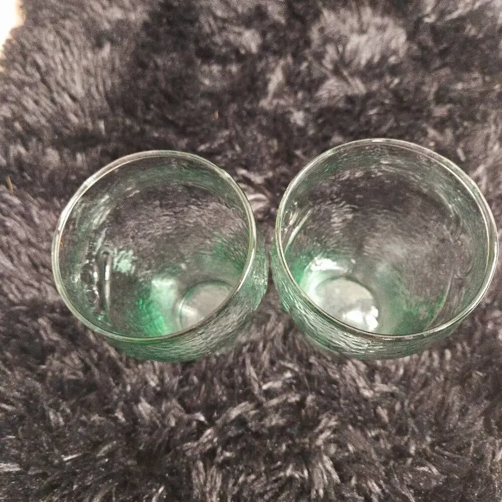 2 vintage Coca-Cola glasses with a green tint and a textured surface, often call